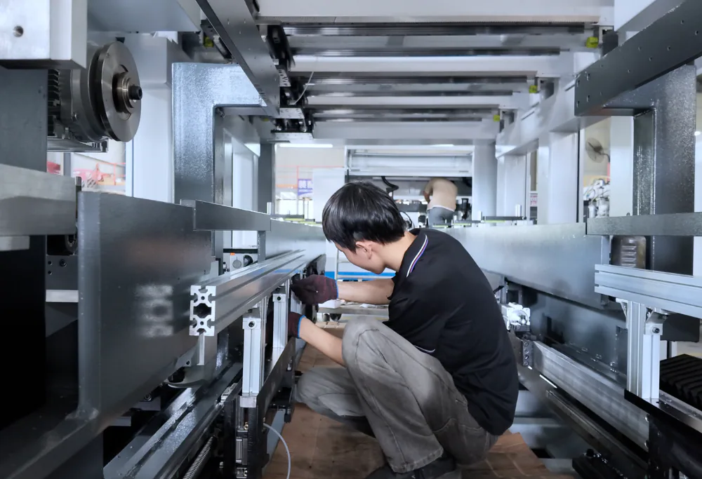Jasper CNC technician assembling and aligning a woodworking machine