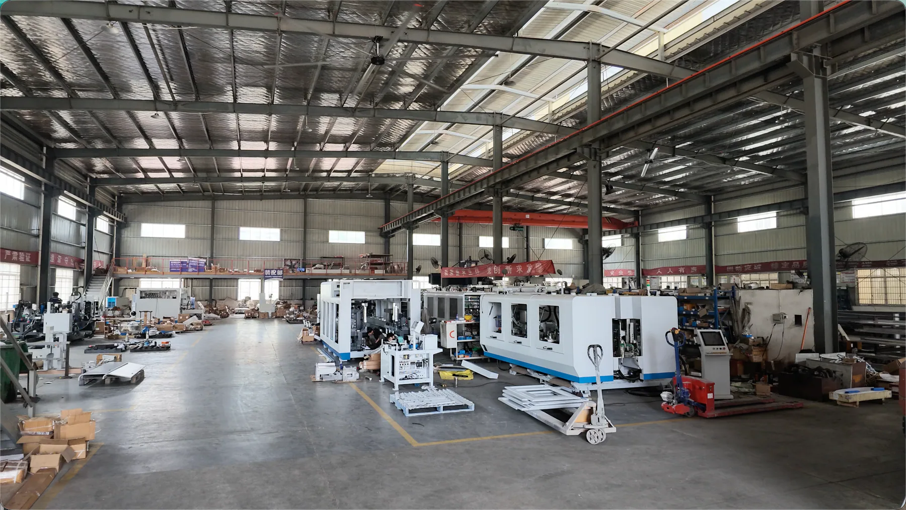 Wide view of the Jasper CNC workshop and machine integration area
