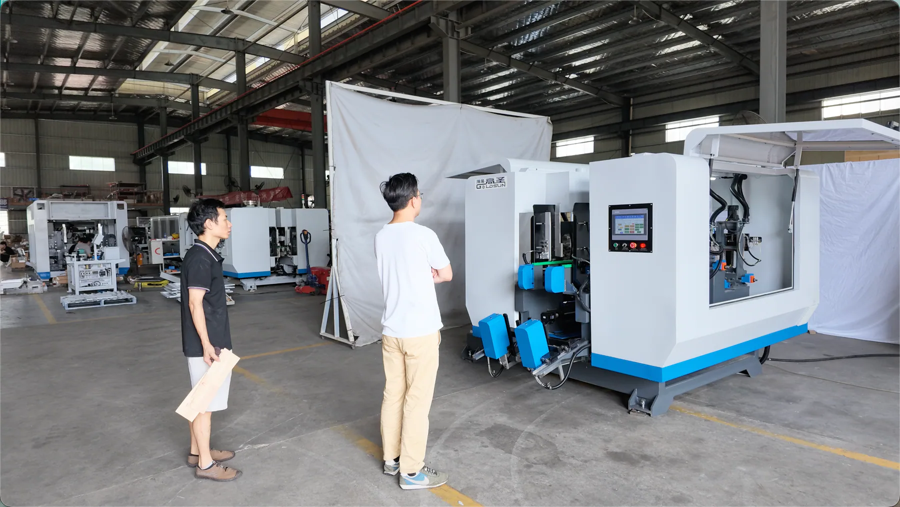 Jasper CNC team inspecting and commissioning a woodworking machine